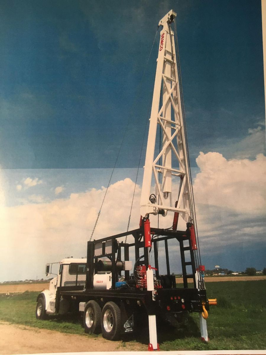 Pecos Well Service pump-hoist rig set up to pull and set a well pump